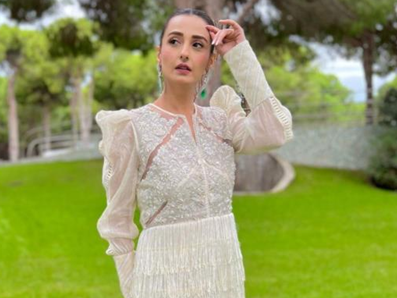 Momal radiates charm in white outfit