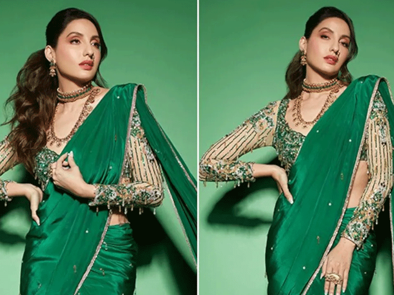 Nora looks elegant in emerald green saree