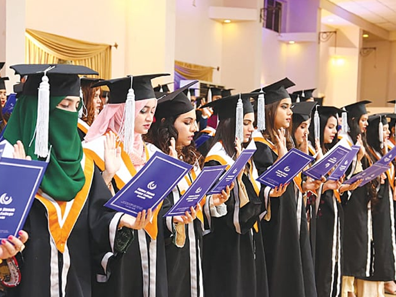 Passing out students awarded degrees at FJDC convocation, anniversary