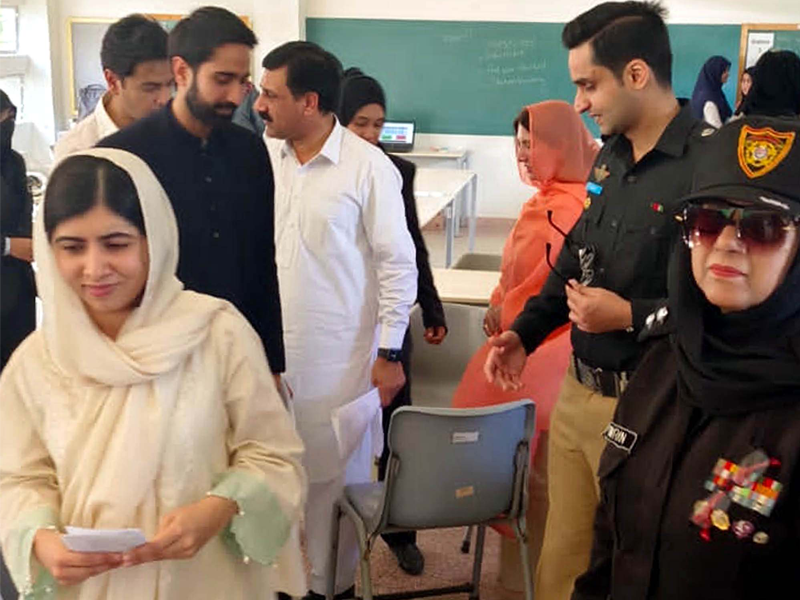 Malala Yousufzai lands in Karachi with her parents