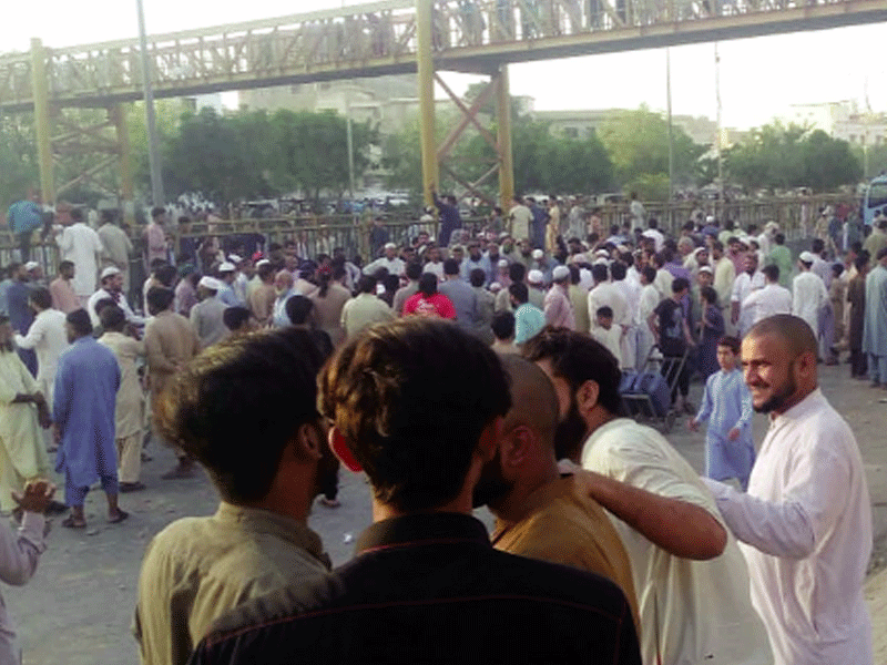 Residents of Mujahid Colony stage protest against razing down homes, block main road